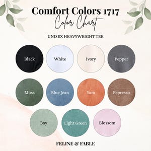 Pu&ograve; includere: Tabella colori per t-shirt unisex Comfort Colors 1717. La tabella mostra 10 campioni di colore: nero, bianco, avorio, pepe, muschio, blu jeans, igname, espresso, baia, verde chiaro e fioritura. Il marchio "FELINE & FABLE" &egrave; in basso.
