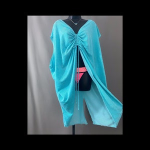 Turquoise terry cloth drawstring V neck cap sleeve breezy top, short caftan or bathing suit coverup. Shown on black dress form over neon bright coral and pink bikini bottom and turquoise butterfly choker.
