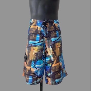 80s mens surfer swim wear, vintage blue and gold beach print board shorts