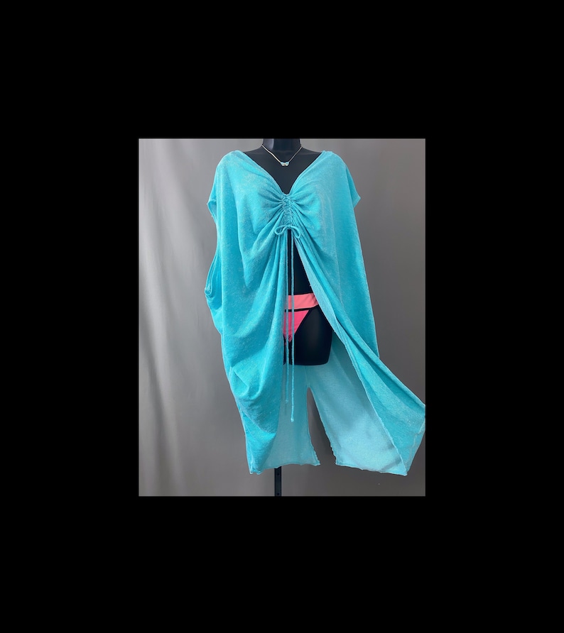 Turquoise terry cloth drawstring V neck cap sleeve breezy top, short caftan or bathing suit coverup. Shown on black dress form over neon bright coral and pink bikini bottom and turquoise butterfly choker.
