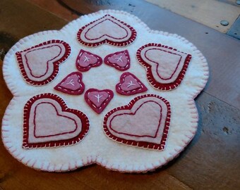Valentine hearts wool candle mat, white background