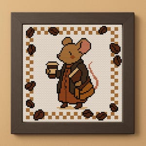 May include: Cross-stitch art of a mouse holding a coffee cup, wearing a brown coat and carrying a satchel. The artwork is framed in a dark brown frame, with a border of coffee beans and a checkered pattern.