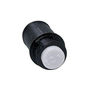 May include: A white ceramic mug with a black handle and the text "But First, Coffee" in a bold, black font. The mug is set against a blurred background, suggesting a cozy setting. The mug appears to be approximately 4 inches tall.