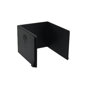 May include: A black, U-shaped, plastic desk organizer. The organizer has a rectangular base and two upright sides. The left side features a logo of a lightbulb with a brain inside. The organizer is designed to hold papers or other desk items.
