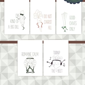May include: Set of six printable kitchen dish towels featuring funny vegetable puns. The towels feature illustrations of a pickle, carrot, leek, romaine lettuce, and beet. The text on the towels reads: "I'm kind of a big dill", "I do not carrot all", "Good chives only", "Romaine calm", "Turnip the beet".