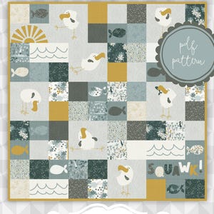 May include: A patchwork quilt featuring a grid of squares with illustrations of seagulls, fish, waves, and suns in shades of mustard yellow, dark teal, and gray. The text "SQUAWK!" appears in the bottom right and on a decorative label below.