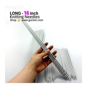 May include: A set of 16 inch long, silver knitting needles.  LONG - 16 inch Knitting Needles Shop www.guchet.com