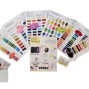 May include: Assortment of colorful embroidery floss color cards, a tools and notions brochure, and a 10% off coupon. The color cards are labeled with the brand name "cuchet.com".