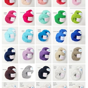 May include: A collection of Queens Cotton yarn skeins in various solid colors including white, yellow, gold, orange, red, peach, coral, pink, fuchsia, aquamarine, green, lime, turquoise, aqua, blue, navy, lavender, purple, beige, khaki, brown, gray, and black.