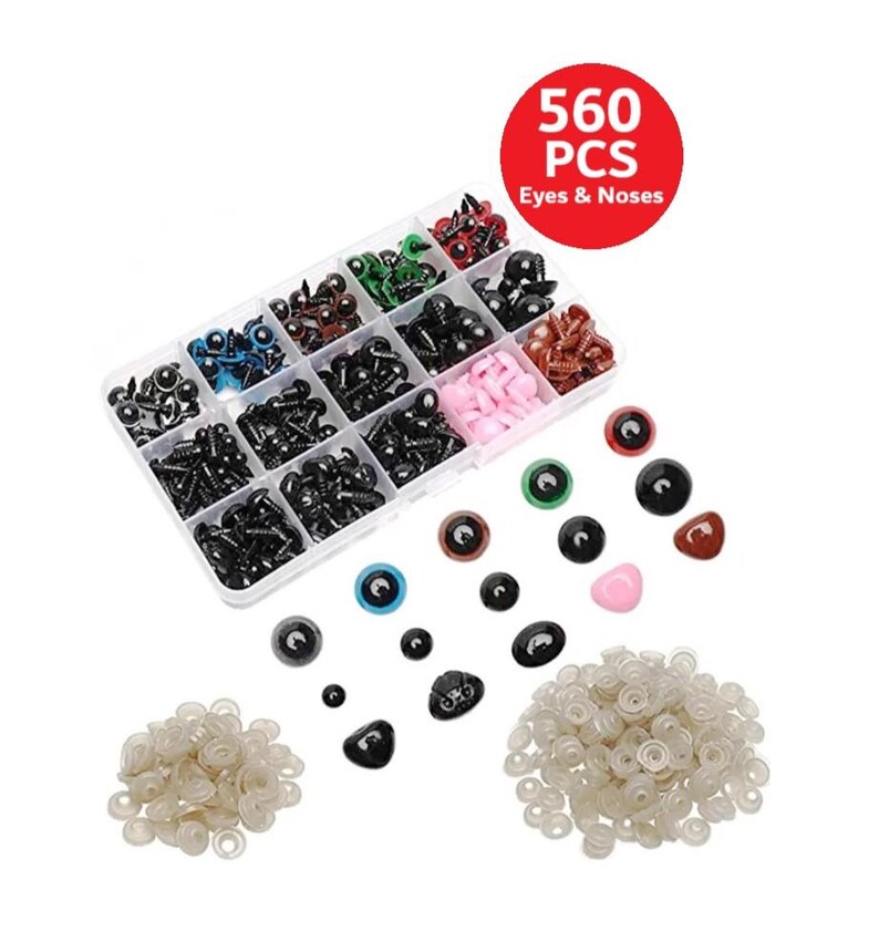 May include: A clear plastic container filled with a variety of black, brown, blue, green, and pink plastic eyes and noses. The container is labeled "560 PCS Eyes & Noses". There are also loose plastic eyes and noses in different sizes and colors scattered around the container.