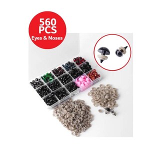 May include: A clear plastic container filled with a variety of colorful plastic eyes and noses. The container is labeled "560 PCS Eyes & Noses". There are also loose plastic eyes and noses in the image.