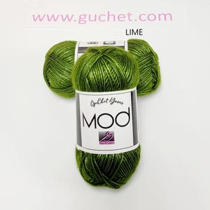 May include: Three skeins of lime green yarn arranged in a cluster. Each skein features a white paper label with the text Guchet Yarns MOD and a logo. The text www.guchet.com and the word LIME are printed above the yarn on the white background.
