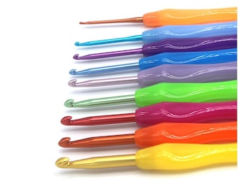 May include: A set of eight colorful crochet hooks with ergonomic handles. The hooks are arranged in a rainbow pattern, starting with orange and ending with gold.