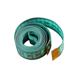 May include: A turquoise measuring tape with black numbers, rolled up and secured with a gold metal clasp.