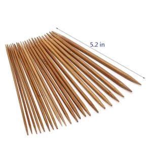 May include: A set of 20 bamboo knitting needles in various sizes, ranging from 2.75 to 5.5 mm. The needles are 5.2 inches long and have a natural wood finish.