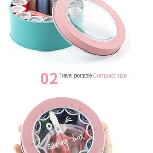 May include: A pink and teal sewing box with a clear lid. The box is filled with spools of thread, needles, and other sewing supplies. The box is labeled "Sewing box".