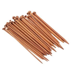 May include: A set of wooden knitting needles in various sizes. The needles are made of natural bamboo and have a smooth, polished finish.