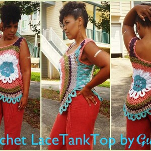 May include: A crocheted tank top with a colorful floral design. The top is sleeveless and has a scalloped hem. The top is made with a variety of colors, including pink, blue, green, and white.