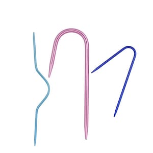 May include: Three crochet hooks in different colors: pink, blue, and light blue. The hooks are made of metal and have a curved shape.