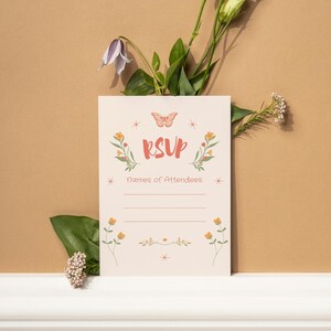 RSVP card for printable Bloom Bar bridal shower invite set. Light pink floral RSVP with whimsical butterfly and wildflower design, styled with greenery and blooms on a warm neutral background.