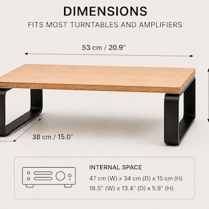May include: A rectangular wooden turntable stand with black metal legs. Dimensions are 20.9 inches wide, 15.0 inches deep, and 6.5 inches high. The internal space measures 18.5 inches wide, 13.4 inches deep, and 5.9 inches high. Text reads DIMENSIONS.