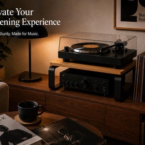 May include: A wooden turntable stand with black metal legs, supporting a black turntable with a clear dust cover and a black audio amplifier underneath. The text reads: Elevate Your Listening Experience. Stylish. Sturdy. Made for Music.