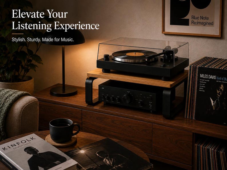 May include: A wooden turntable stand with black metal legs, supporting a black turntable with a clear dust cover and a black audio amplifier underneath. The text reads: Elevate Your Listening Experience. Stylish. Sturdy. Made for Music.