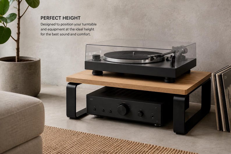 May include: A wooden turntable stand with black metal legs, featuring a light wood top surface and a black base. The stand holds a black turntable with a clear cover on top and a black audio amplifier underneath. Text reads: PERFECT HEIGHT.