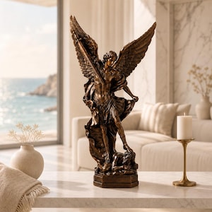May include: A bronze-coloured statue depicting an angel with large, detailed wings holding a sword aloft whilst standing over a fallen figure. The sculpture features intricate textures on the wings and armour, set upon a hexagonal base.