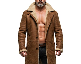 May include: A long, brown suede coat featuring a wide, tan shearling collar and matching shearling lining along the front opening and cuffs. The coat is designed with a button-front closure, long sleeves, and a smooth, matte exterior finish.
