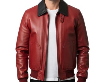 May include: A red leather bomber jacket with a black collar and a zip-up front. The jacket has two front pockets and a ribbed hem and cuffs. The model is wearing a white t-shirt underneath.