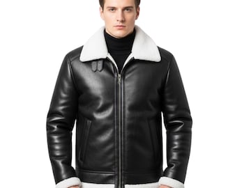 May include: Black leather jacket with a white shearling collar and trim. The jacket features a front zipper closure and a classic aviator style. The model is wearing a black turtleneck underneath.