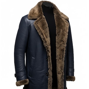 May include: A navy blue shearling coat with a brown fur collar and lining. The coat has a button closure and two pockets.