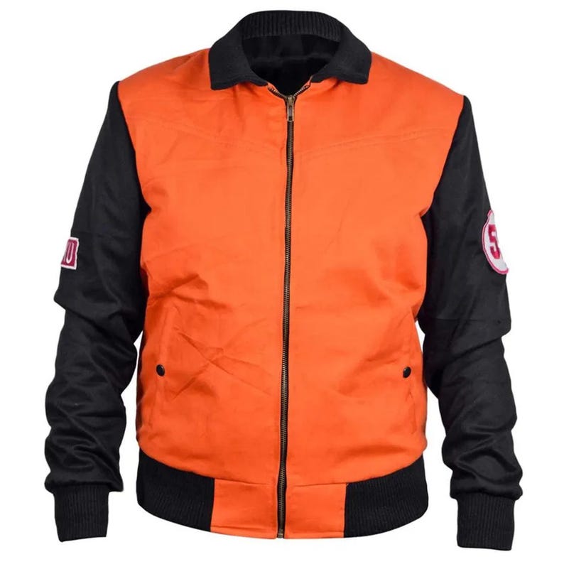 May include: Orange and black bomber jacket with a black collar and cuffs. The jacket has a full-length zipper and two small pockets. Patches with the number 5 and a letter are on the sleeves.