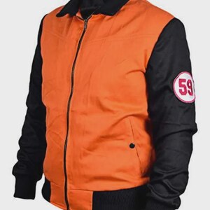 May include: Orange and black bomber jacket with a black collar and cuffs. The jacket has a zipper closure and a circular patch on the left sleeve with the number 59 in white and red. The jacket is a casual style.
