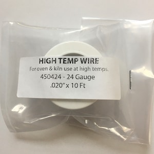 May include: White spool of high temperature wire for use in ovens and kilns. The label reads "HIGH TEMP WIRE", "For oven & kiln use at high temps.", "450424 - 24 Gauge", ".020" x 10 Ft".