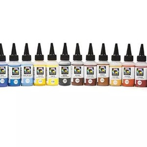 May include: A set of 20 acrylic paint bottles with black caps. The bottles are arranged in a row and contain various colors, including blue, green, yellow, red, brown, and white.