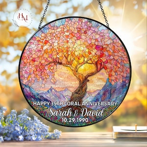 May include: A round stained glass window featuring a tree with a vibrant orange and pink canopy, set against a sunset backdrop. The text reads "Happy 35th Coral Anniversary" with the names "Sarah & David" and the date "10.29.1990".