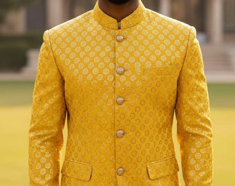 May include: A golden yellow jacket with a mandarin collar and a repeating circular pattern. The jacket has a row of round, silver buttons down the front and two pockets. The sleeves are long, and the fabric has a subtle sheen.