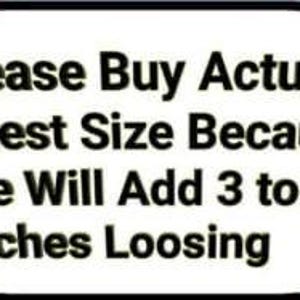 May include: A white oval sign with a black border and text that reads "Please Buy Actual Chest Size Because We Will Add 3 to 6 Inches Loosing". The sign is on a blue background.