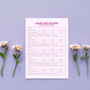 May include: A pink task decoder sheet with the text "DOOM TASK DECODER". The sheet is designed for tracking tasks, estimated time, and actual time taken. White and pink daisies are on the left and right sides of the sheet.