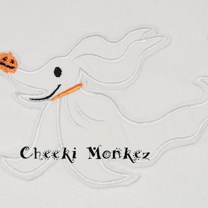 May include: White embroidered Zero from The Nightmare Before Christmas, holding an orange pumpkin. The design includes a black eye, a black smile, and an orange collar. The text "Cheeki Monkez" is below the character.
