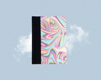 May include: A hardcover notebook with a black spine and a cover featuring a colorful, swirled pattern in shades of blue, pink, yellow, and purple. The notebook is set against a light blue background with a cloud.
