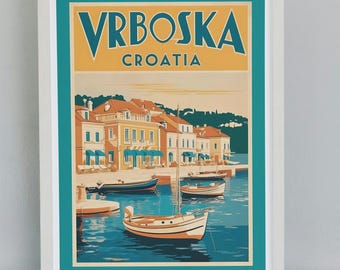 May include: A framed travel poster for Vrboska, Croatia, featuring a coastal town scene with boats and buildings. The poster has a teal border and the town's name in yellow and teal.