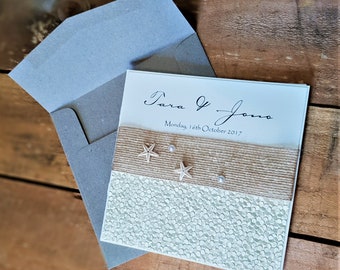 Rustic Beach Wedding Invitations with ivory pebble paper feature, natural starfish, pearls & jute