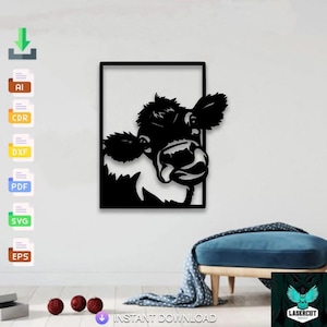 May include: Black metal cow wall art in a rectangular frame. The cow's head is the focal point, with detailed features. The artwork is mounted on a white wall. The words "INSTANT DOWNLOAD" are at the bottom.