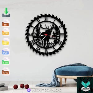 May include: Black metal wall clock featuring a deer silhouette in a forest scene. The clock has Roman numerals and a saw blade-style outer edge. The clock hands are white with a red second hand. The clock is mounted on a white wall.