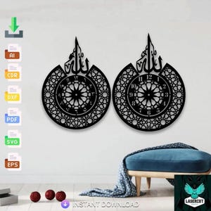May include: Two black laser-cut wall clocks with Arabic calligraphy and intricate geometric patterns. The clocks have a circular design with numbers and star-like details. The clocks are mounted on a white wall.