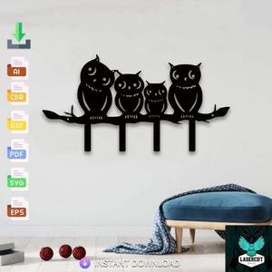 May include: Black metal wall art featuring four owls perched on a branch. The owls have large eyes and are of varying sizes. The branch has four hooks below the owls. The words "INSTANT DOWNLOAD" are at the bottom.