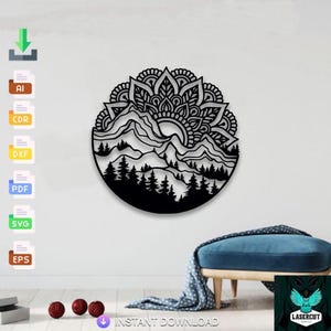 May include: Black laser-cut metal wall art featuring a mountain landscape with a sun and mandala design. The artwork includes a forest of trees at the bottom and is circular. The text "INSTANT DOWNLOAD" is visible at the bottom.